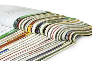 Bright White Background Cutout Impressions: Stack of magazines isolated on white background
