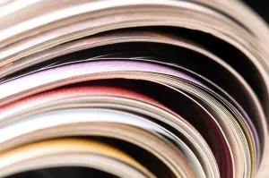 Environmental Conservation Through Reuse Impressions: Stack of open magazines