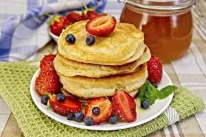 Homemade Pancake Recipes Impressions: A stack of pancakes with strawberries