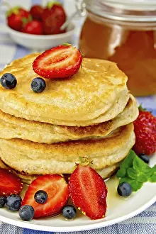 Healthy Fruit Dishes Impressions: A stack of pancakes with strawberries
