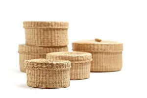 White Studio Setup Impressions: Stack of various sized wicker baskets isolated on white