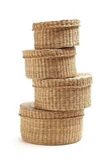 Wicker Baskets Impressions: Stack of various sized wicker baskets isolated on white
