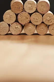 Uninhabited Winery Scene Impressions: Stack of wine corks on a wood surface