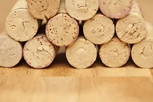 Deserted Wine Cellar Impressions: Stack of wine corks on a wood surface