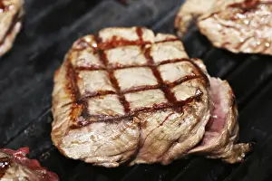 Barbecued Beef Meal Impressions: Steak on the grill with diamond pattern