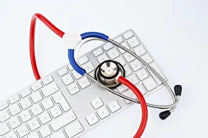 Symbolic Stethoscope Image Impressions: Stethoscope and keyboard of a computer