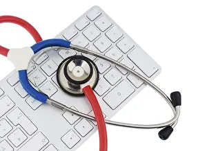 Symbolic Healthcare Image Impressions: Stethoscope and keyboard of a computer