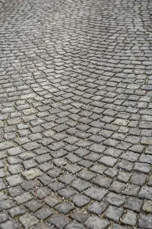 Cobblestone Background Impressions: Stone paving texture. Abstract structured background