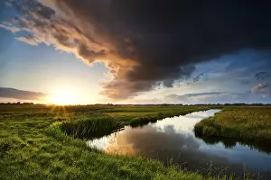 Cloudy Evening Sky Impressions: Storm cloud at dramatic sunset in summertime