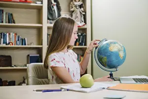 Educational Institution Training Impressions: Student posing with globe table