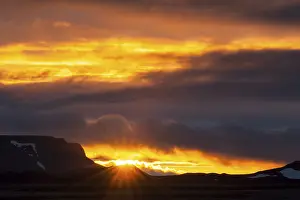 Backlit Mountain View Impressions: Sun breaking through the clouds