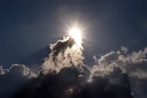 Cloud Formation Impressions: Sun behind dark clouds