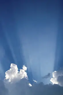 Cloudy Atmosphere Impressions: Sun rays behind clouds