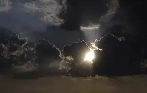 Stormy Sky Impressions: Sun behind storm clouds