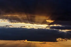 Dramatic Evening Sky Impressions: Sunbeams behind clouds, dramatic evening sky