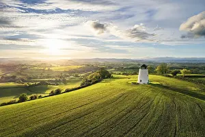 UK Countryside Views Impressions: Sunnset over Devon Windmill over Fields and Farms