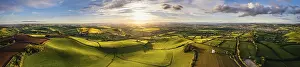 High Angle View Of Devon Fields Impressions: Sunset over Devon Windmill from a drone