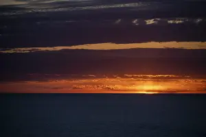 Deserted Beach Mallorca Impressions: Sunset over the sea, with dramatic clouds