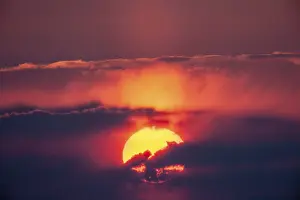Deserted Sunset Impressions: Sunset, sun behind clouds