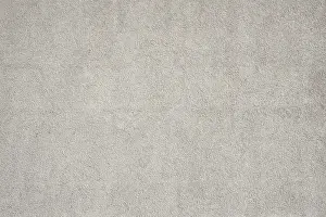 Gray Textured Background Impressions: Surface of a medium gray rough plaster wall