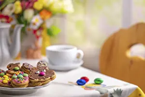 Christian Easter Traditions Impressions: Table with Easter biscuits, coffee and Easter decorations