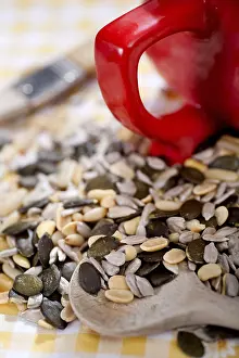 Single Person Baking Impressions: A table with several nuts and kernels