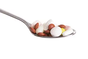 Healthcare Costs Impressions: Tablets on a spoon