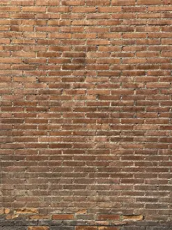 Urban Exterior View Impressions: A textured red brick wall with a consistent horizontal pattern