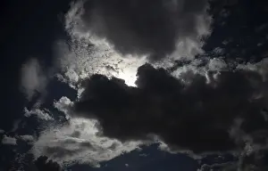 Stormy Atmosphere Impressions: Thundercloud pushes in front of the sun