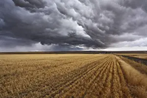 Cloudy Atmosphere Photography Impressions: Thunderclouds above fields after harvesting