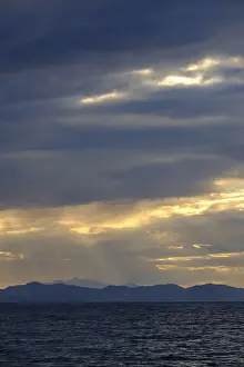 Backlit Cloud Photography Impressions: Thunderclouds at sunset on the beach