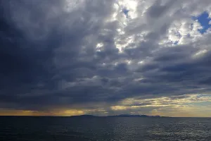 Tuscany Sunset Impressions: Thunderclouds at sunset on the beach