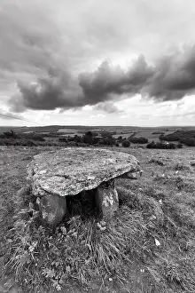 Ireland Dolmen Impressions: Unknown dolmen in a meadow, dramatic cloudy sky
