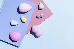 Pastel Color Background Impressions: Top view of an array of multicolored makeup sponges