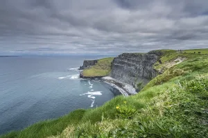 Deserted Rocky Shoreline Impressions: View over Cliffs of Moher on a overcast