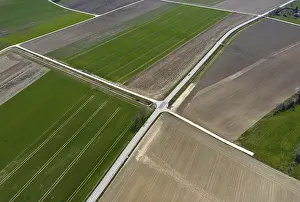 Uninhabited Country Roads Impressions: View from above of a mosaic of fields