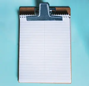 Isolated Background Image Impressions: Top view of notepad on isolated background