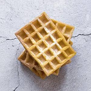 Belgian Waffles Impressions: Top view stack waffles concrete surface