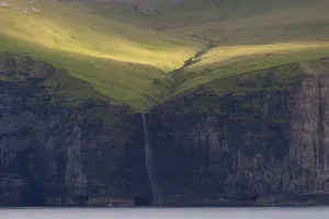 Faroe Islands Waterfall Impressions: Waterfall falling over steep cliffs