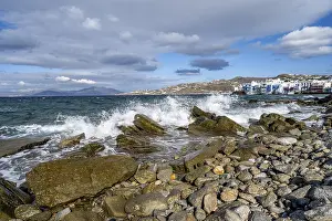 Mediterranean Beach Scene Impressions: Waves breaking between the rocks on the beach