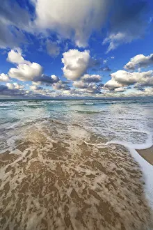 Beach Landscape Photography Impressions: Waves lapping on the sandy beach