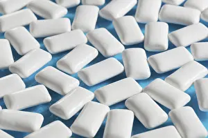 Blue Background Sweets Impressions: White rectangular Chewing gums on blue
