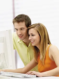 Young Couple Impressions: Young couple using a computer