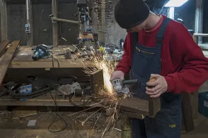 Young Man In Workshop Impressions: Young man at a Flex in his workshop